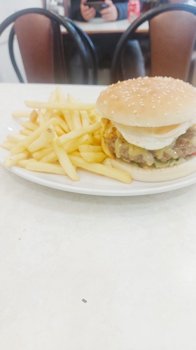Burger in a plain bun with chips